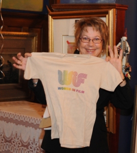 Ginny Durrin, former WIFV president, holds up the first ever WIFV tee-shirt--printed when WIFV was founded in 1979.  Durable AND fashionable apparel?  Just one of the many wonderful things WIFV has to offer.  
